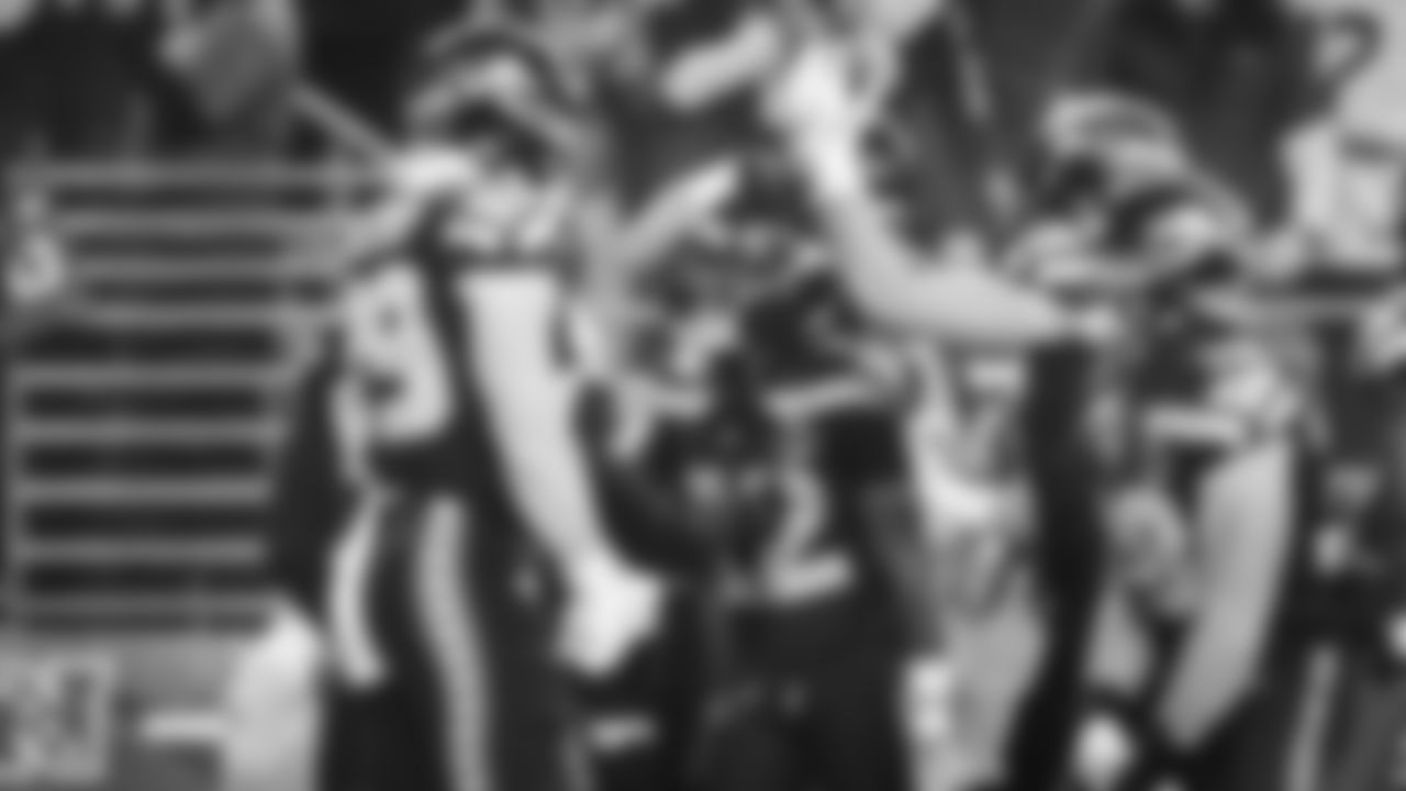 Seahawks return specialist Rashid Shaheed celebrates with teammates after his kickoff return for touchdown on the game's opening play.