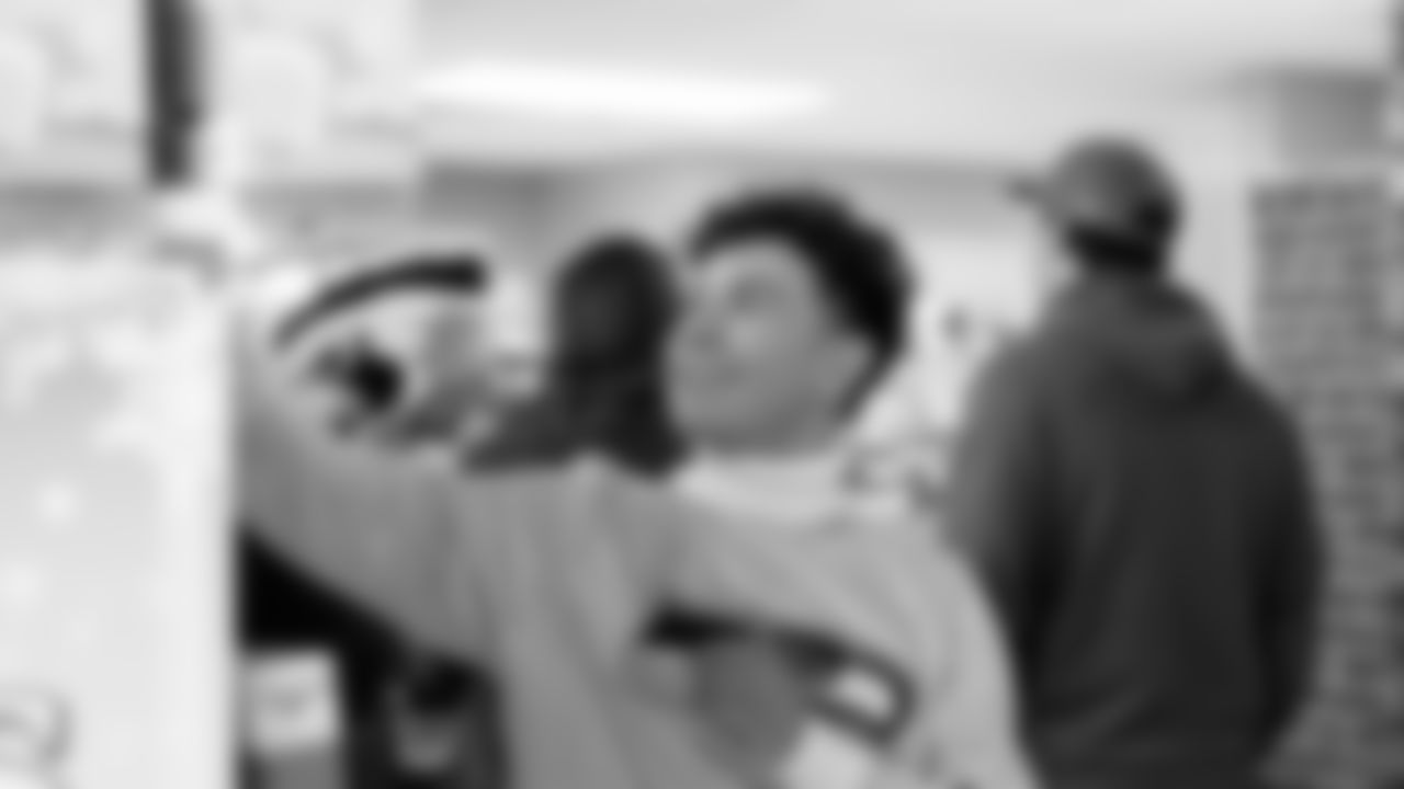 Seahawks Fullback Brady Russell, the Seahawks Dancers, and Blitz spent the day volunteering at Santa's Castle on Joint Base Lewis-McChord to celebrate the holidays and support service members and their families.