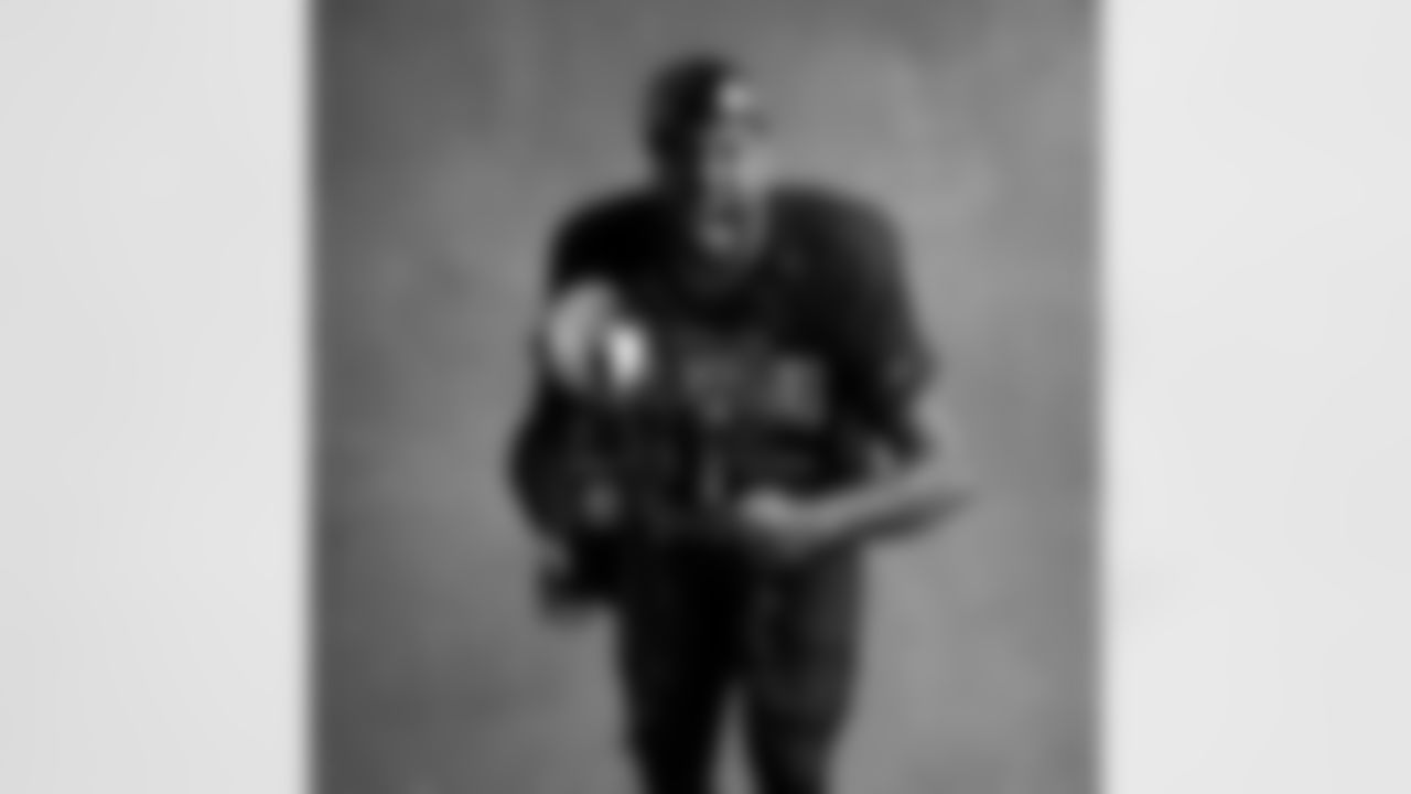 Seahawks defensive end Leonard Williams (99) with the Lombardi Trophy after winning Super Bowl LX.