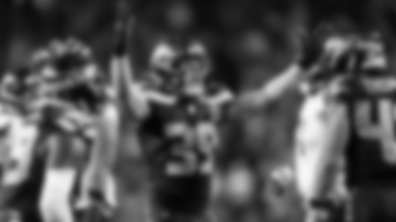 Seahawks safety Ty Okada celebrates after sacking Texans quarterback C.J. Stroud.