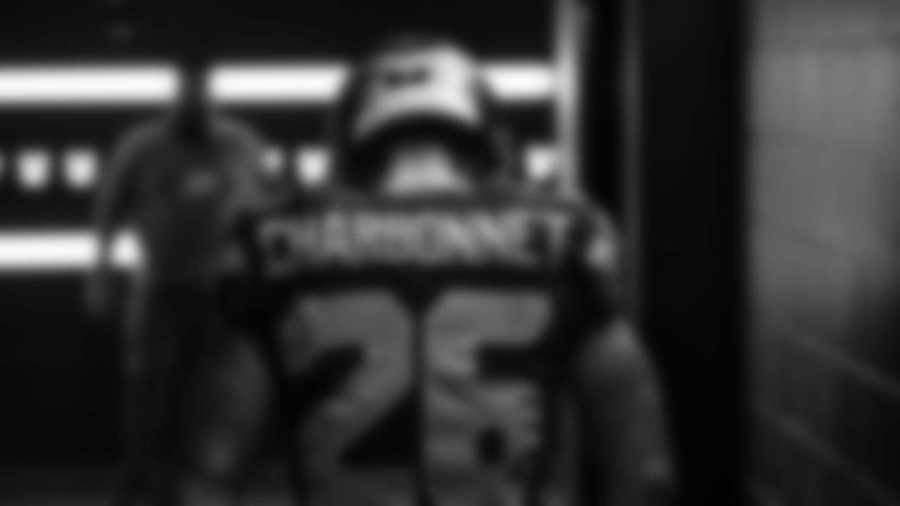 Seahawks running back Zach Charbonnet (26) walks through the Emerald Queen Casino tunnel club at Lumen Field for the Week 10 matchup vs. the Cardinals.