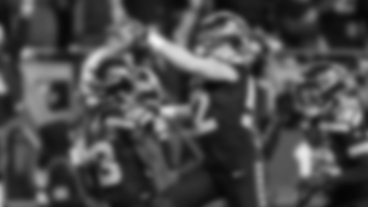 Seahawks Dareke Young, Patrick O'Connell and Ty Okada celebrate Young's recovery of a muffed punt in the third quarter.