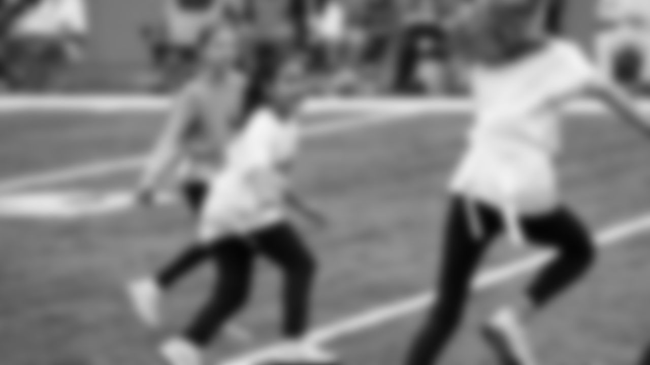 The Seahawks Women's Association packed girls flag kits and hosted a free girls flag football camp at the Seahawks training facility on Saturday, November 8, 2025.