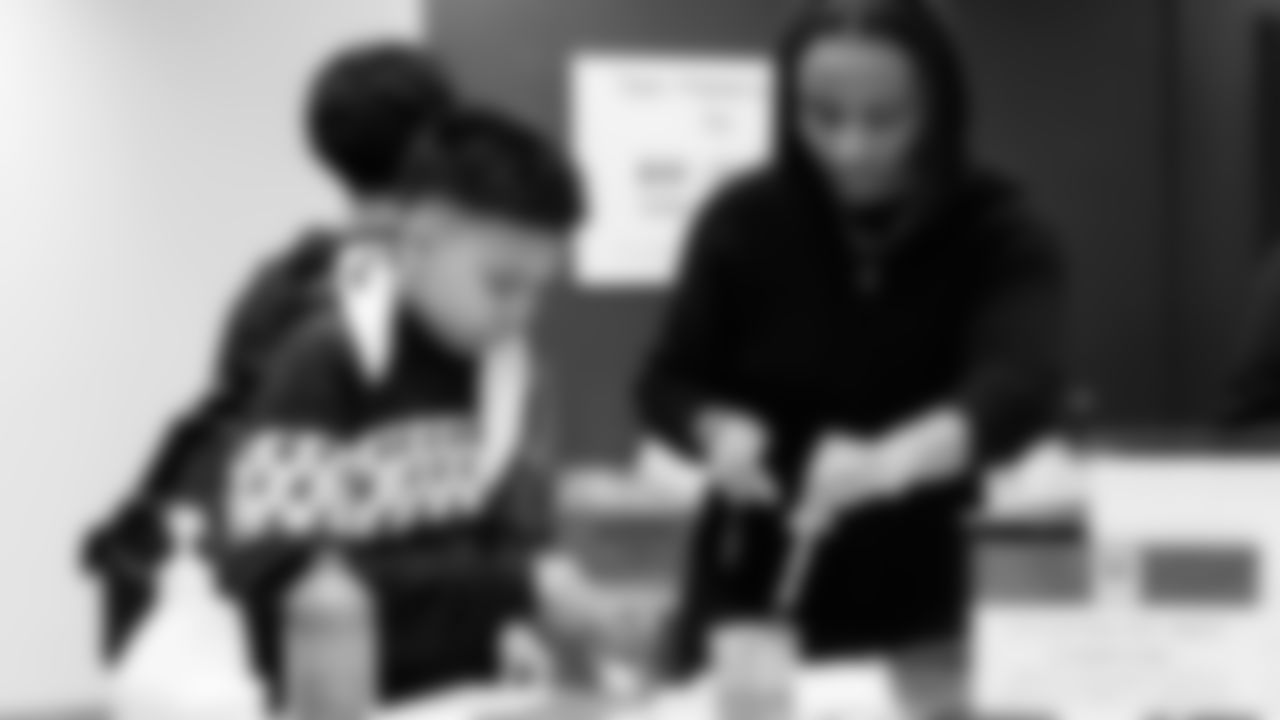 Seahawks Legend Garry Gilliam and Seahawks Dancers surprised teens at the Lake Hills Boys & Girls Club for a fun afternoon of Seahawks activities and crafting. One lucky winner also went home with two tickets to the Divisional Playoff game!