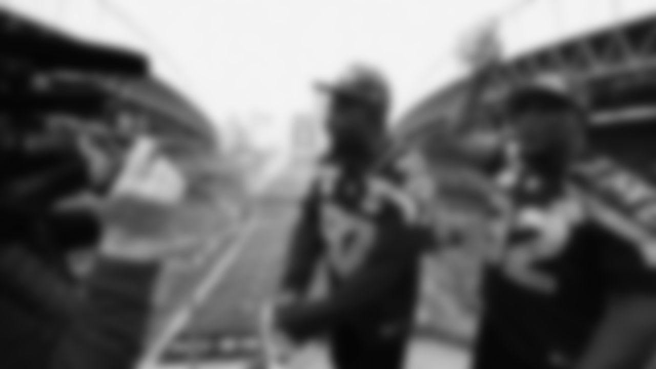 Seahawks Legends Rufus Porter and John L. Williams raise 12 flag in week 15 on December 14, 2025