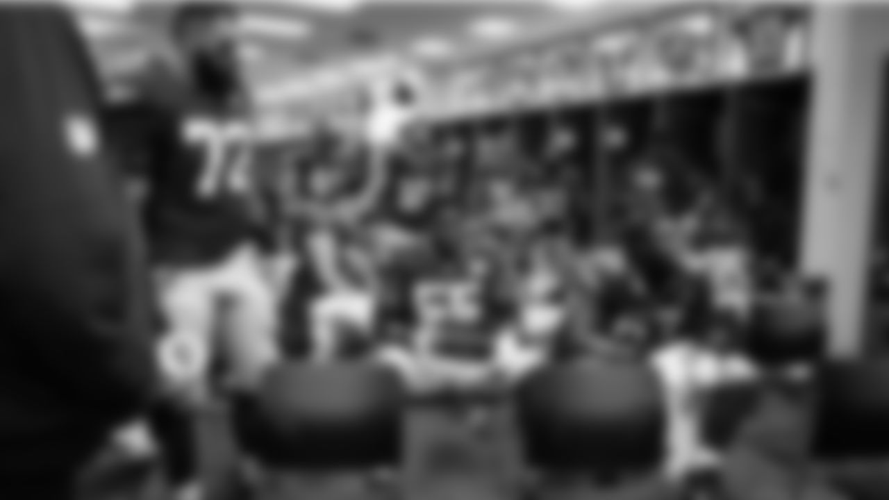 At halftime, the Seahawks offense listens to instructions from coaches.