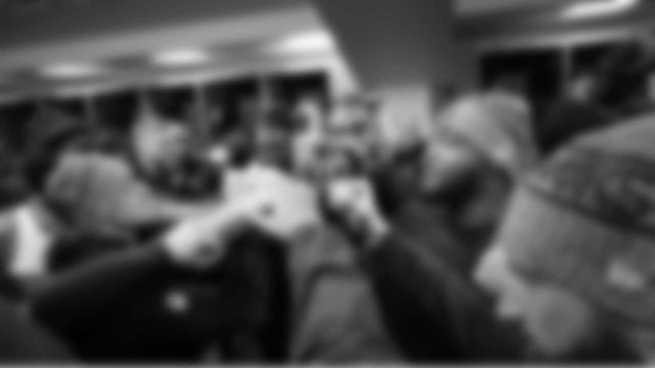 Ernest Jones IV gathers members of the defense in the locker room before the game.