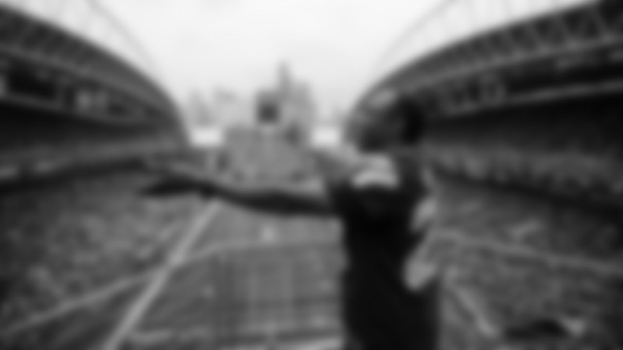 Seahawks Legend Curt Warner raises the 12 Flag before the 2nd preseason game against the Chiefs on August 15th.