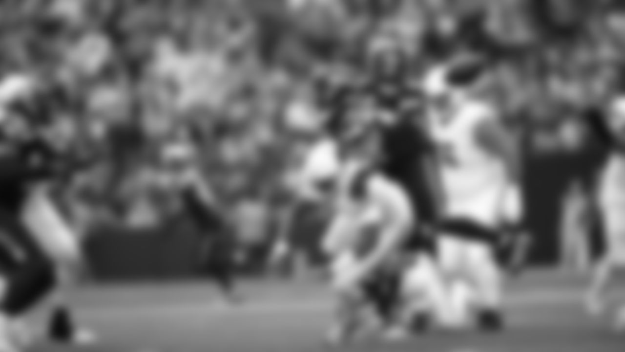 Seahawks linebacker Tyrice Knight (48) sacks Cardinals QB Jacoby Brissett and defensive end DeMarcus Lawrence (0) scoops the ball up and scores the touchdown.