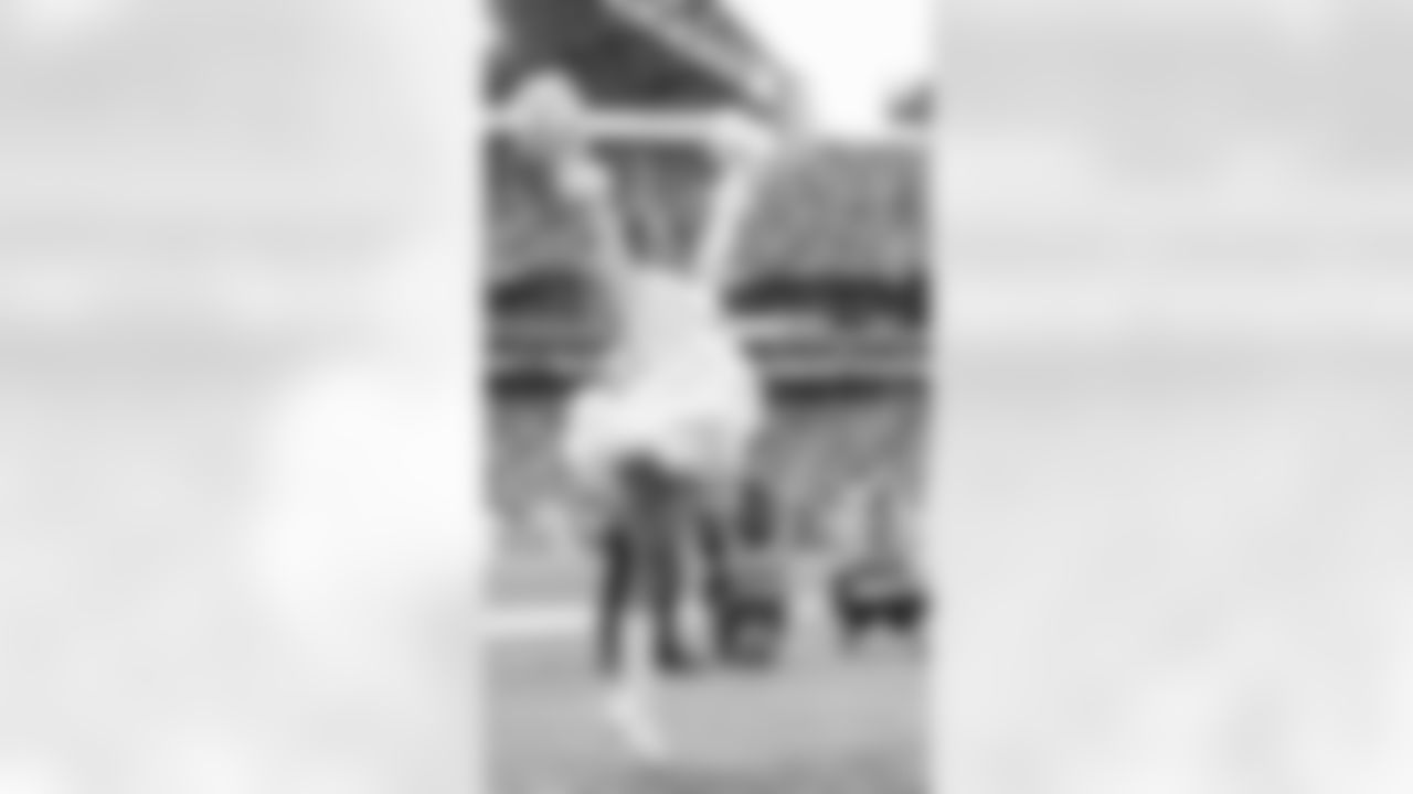 Miranda cheering on the Seahawks on the sidelines of Lumen.