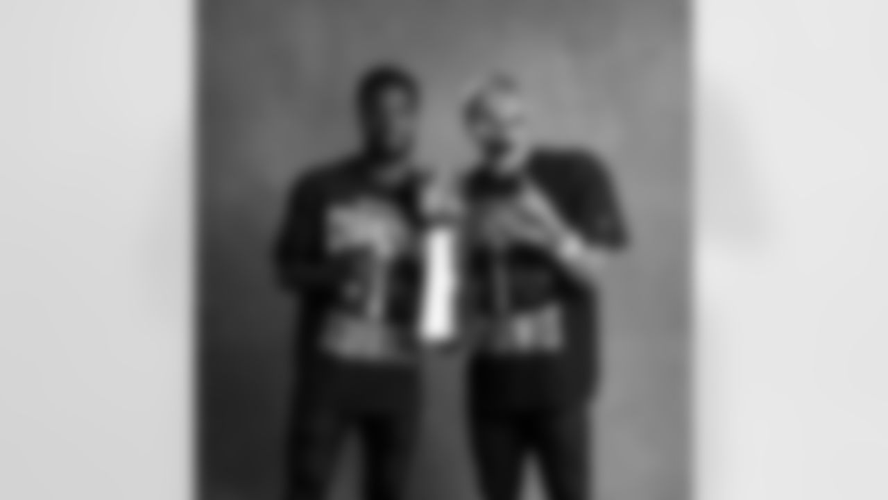 Seahawks cornerback Devon Witherspoon (21) and wide receiver Jaxon Smith-Njigba (11) with the Lombardi Trophy after winning Super Bowl LX.