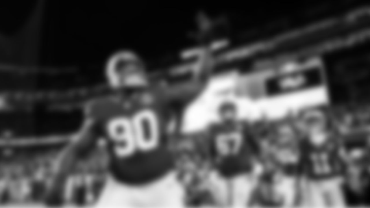 Seahawks defensive lineman Jarran Reed leads the Seahawks onto the field.