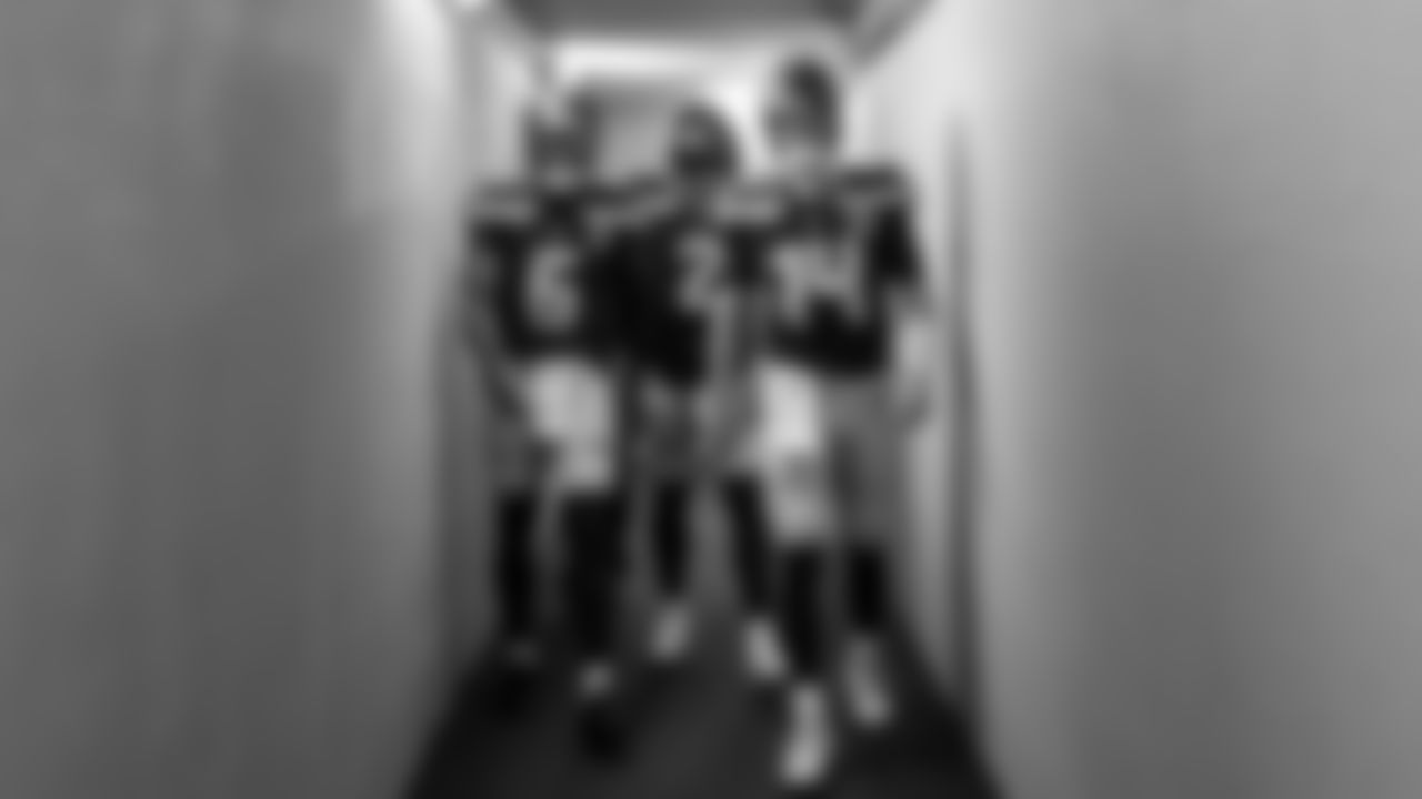 Seahawks quarterback Jalen Milroe (6), quarterback Drew Lock (2) and quarterback Sam Darnold (14) warms up at Lambeau Field for the preseason Week 3 matchup vs. the Green Bay Packers.