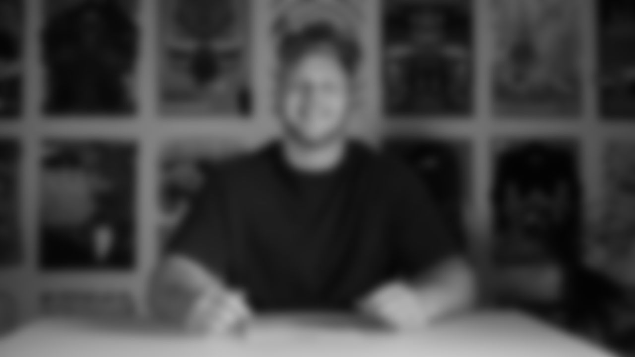 Seahawks defensive tackle Rylie Mills (98) signed his rookie contract on May 12, 2025 at the Virginia Mason Athletic Center.