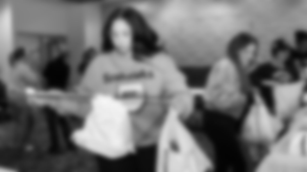 The Seahawks Women's Association packed girls flag kits and hosted a free girls flag football camp at the Seahawks training facility on Saturday, November 8, 2025.