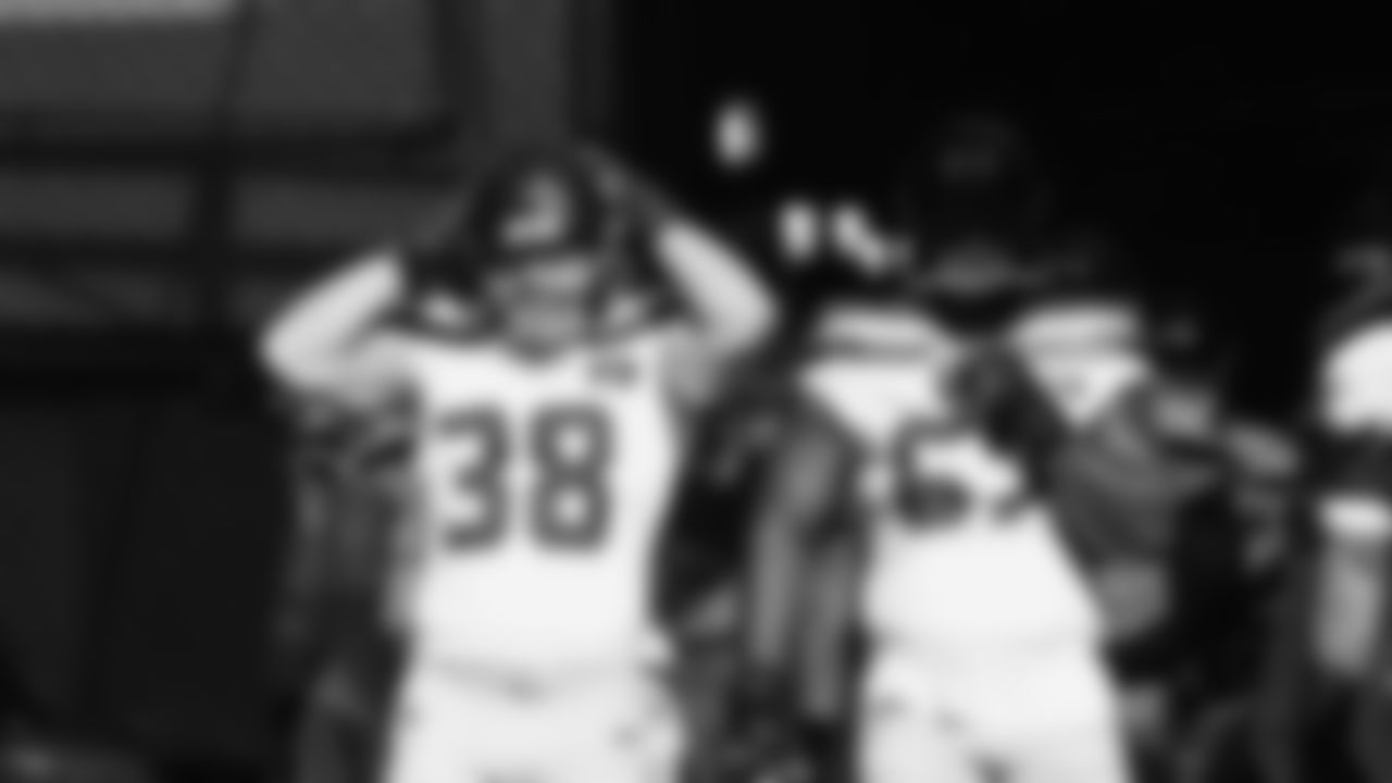 Seahawks fullback Brady Russell (38) and tackle Charles Cross (67) hit the field at Nissan Stadium for the Week 12 matchup vs. the Titans in Nashville, Tennessee.