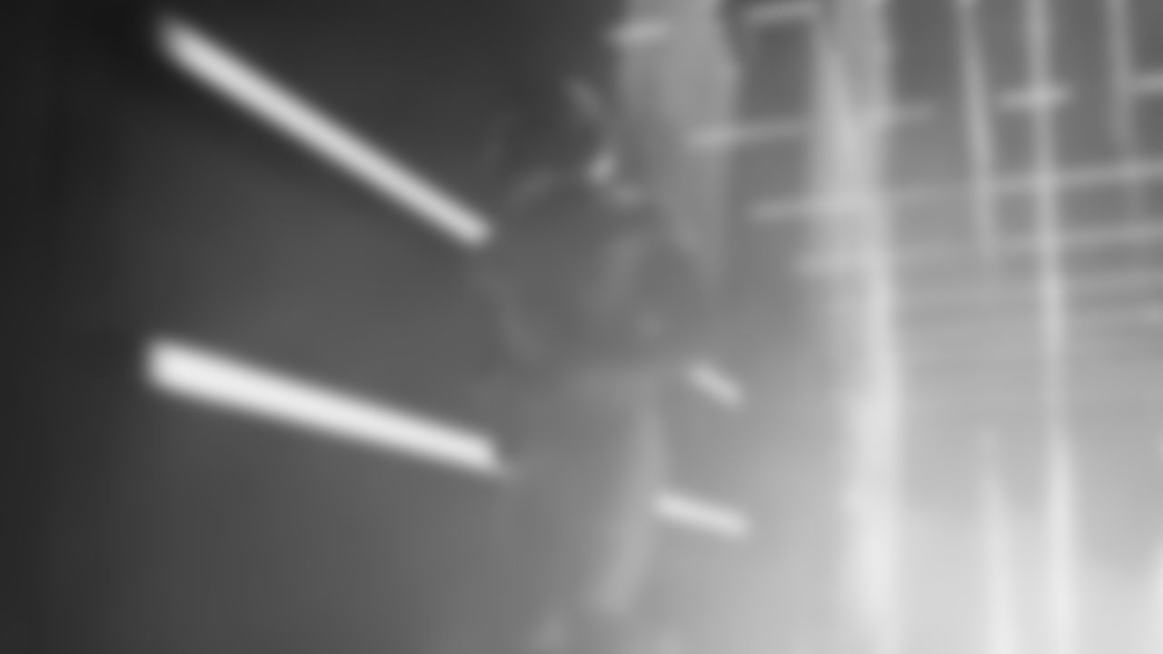 Seahawks running back Kenneth Walker III (9) walks through the Emerald Queen Casino tunnel club at Lumen Field for the Week 16 matchup vs. Rams.