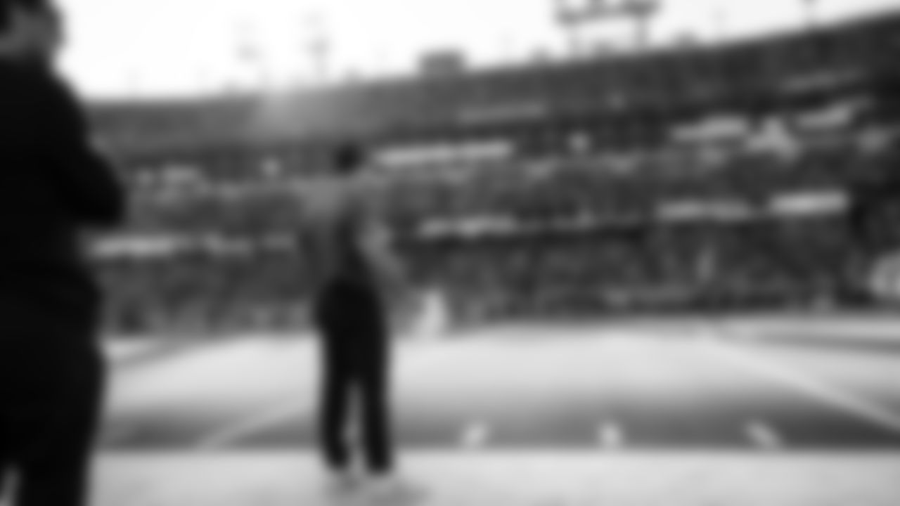 Seahawks head coach Mike Macdonald watches from the sidelines in the late afternoon sun in Nashville.