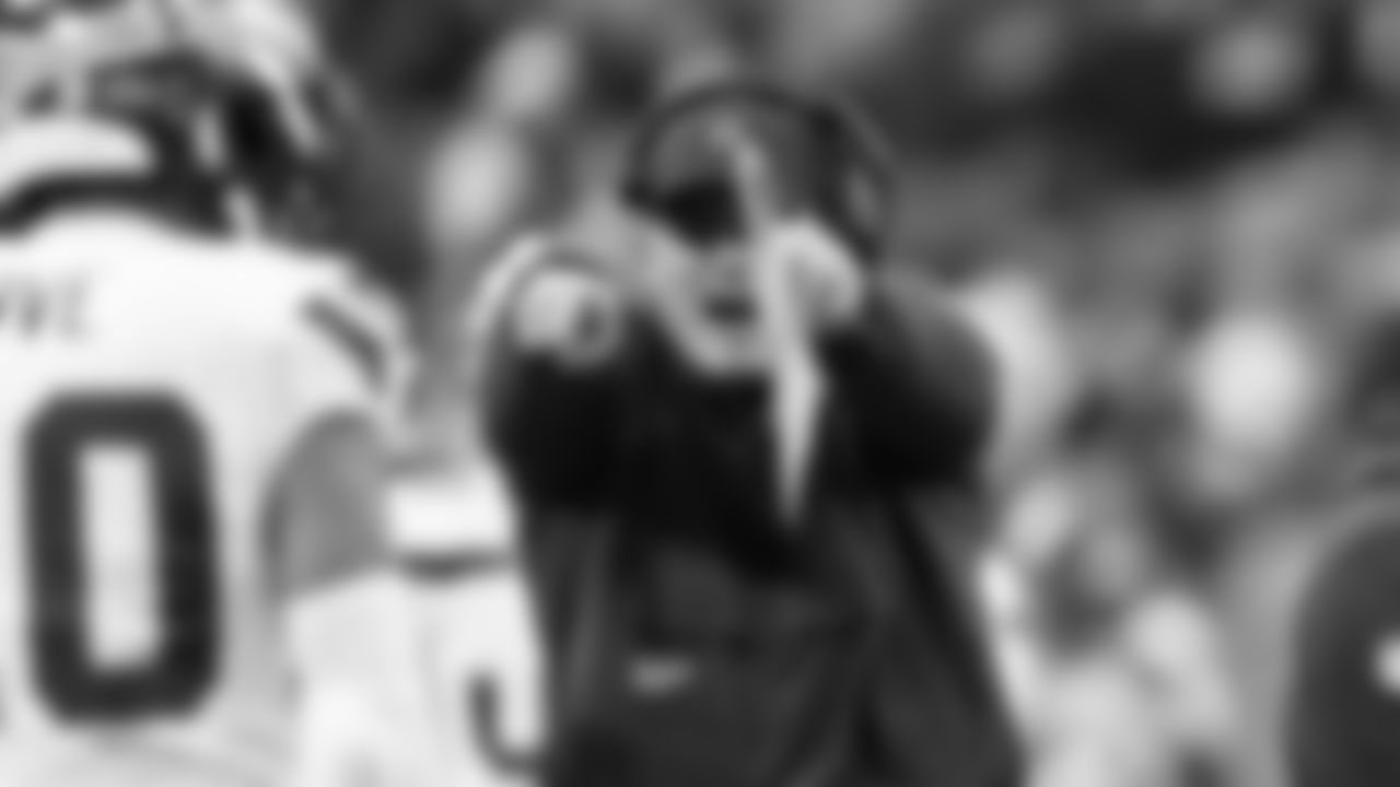 Seahawks head coach Mike Macdonald is fired up and points at safety Julian Love after Love made a stop on fourth down, giving Seattle the ball deep in Carolina territory.