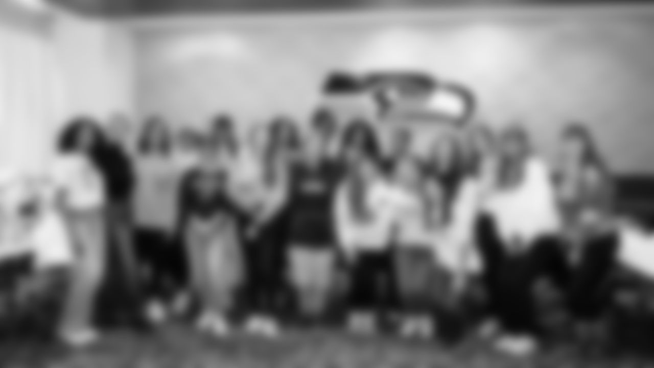 The Seahawks Women's Association packed girls flag kits and hosted a free girls flag football camp at the Seahawks training facility on Saturday, November 8, 2025.