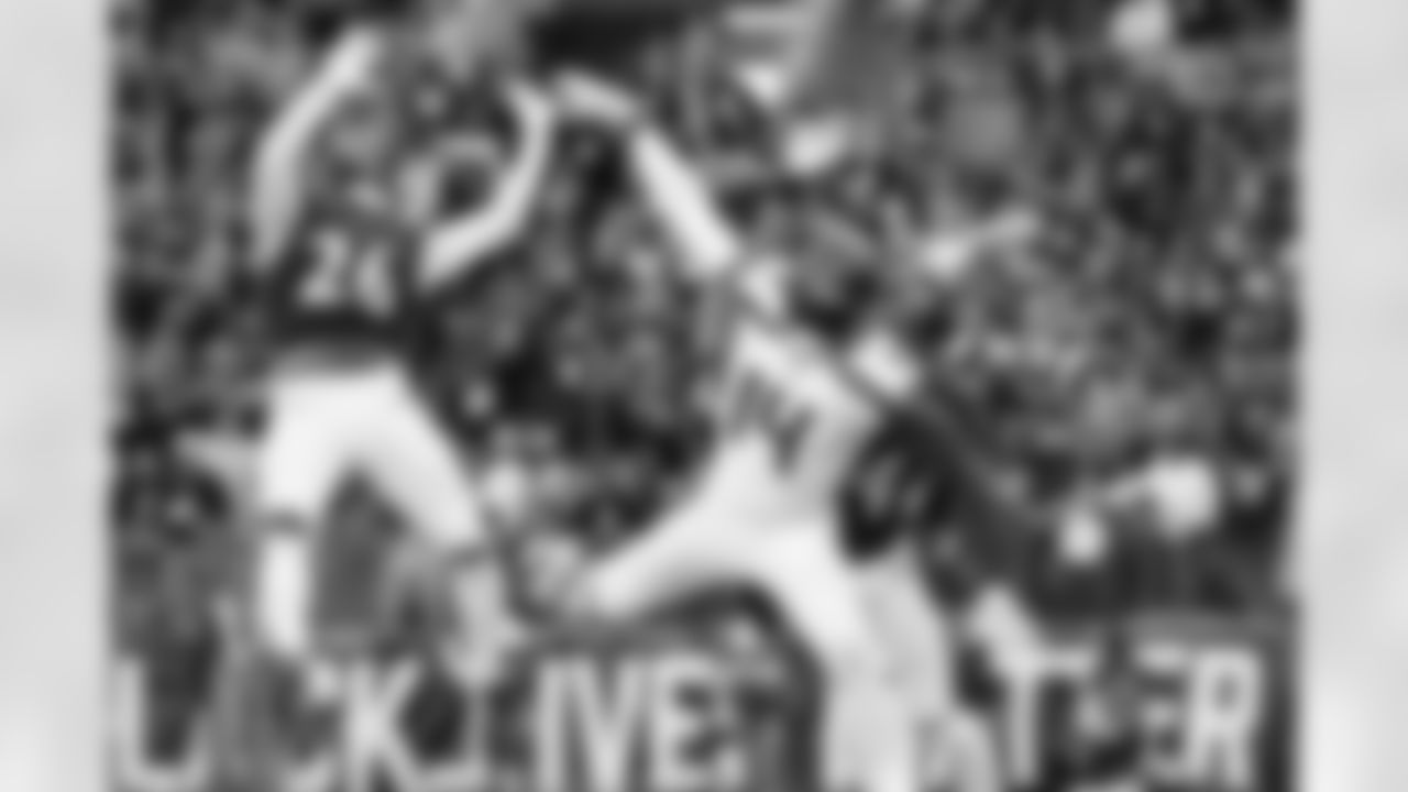 Seahawks receiver DK Metcalf attempts a reception between two Ravens defenders on fourth down and the pass was incomplete.
