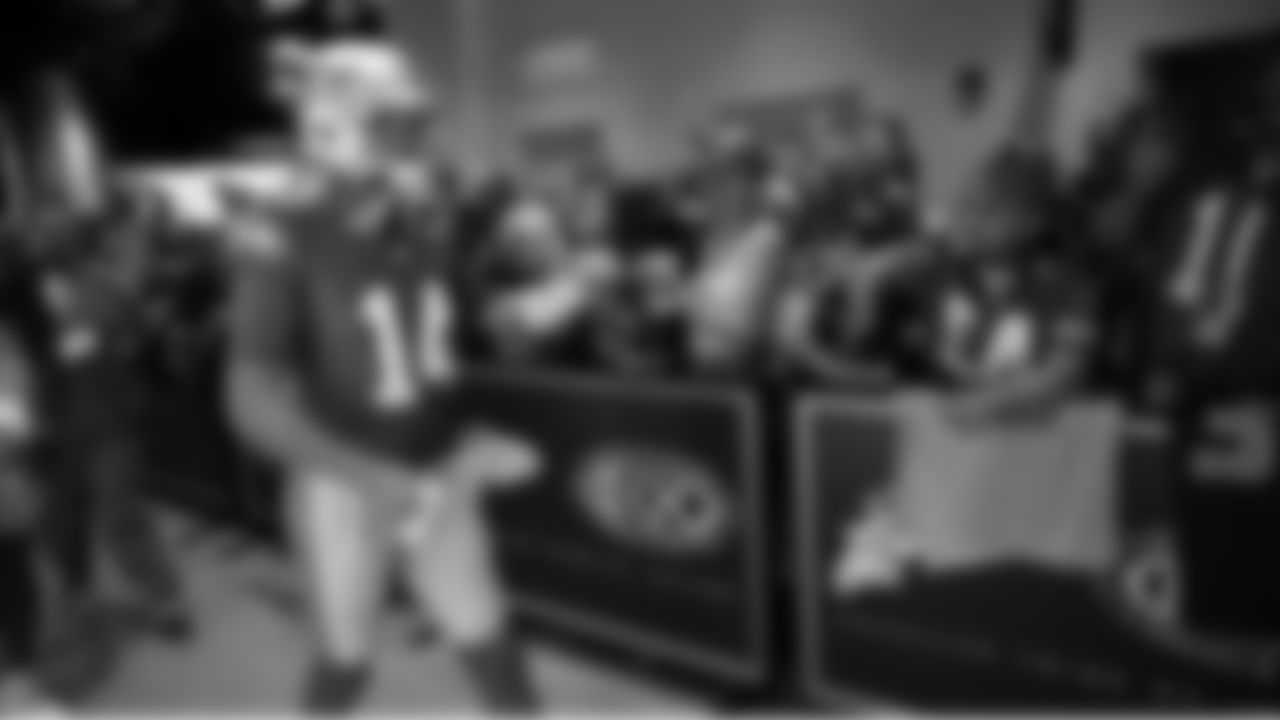 Seahawks quarterback Sam Darnold (14) walks through the Emerald Queen Casino tunnel club at Lumen Field for the Week 5 matchup vs. the Buccaneers.
