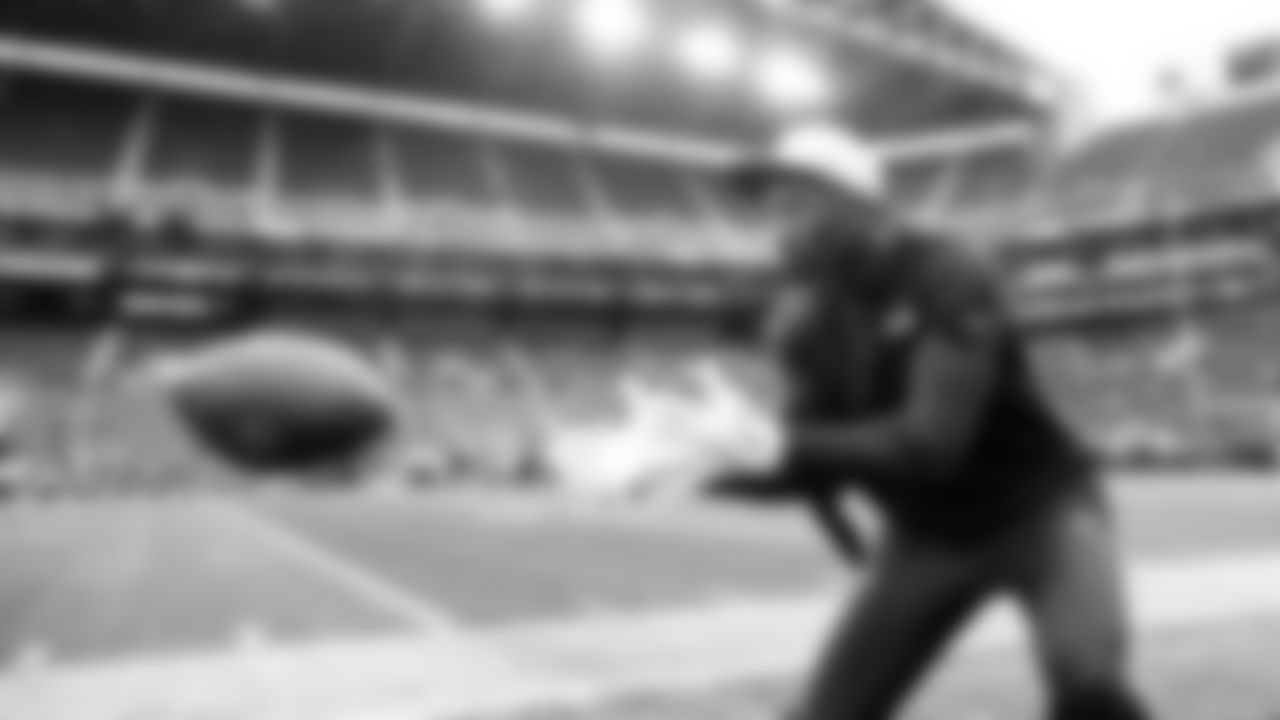 Seahawks receiver Tory Horton catches passes during early pregame.