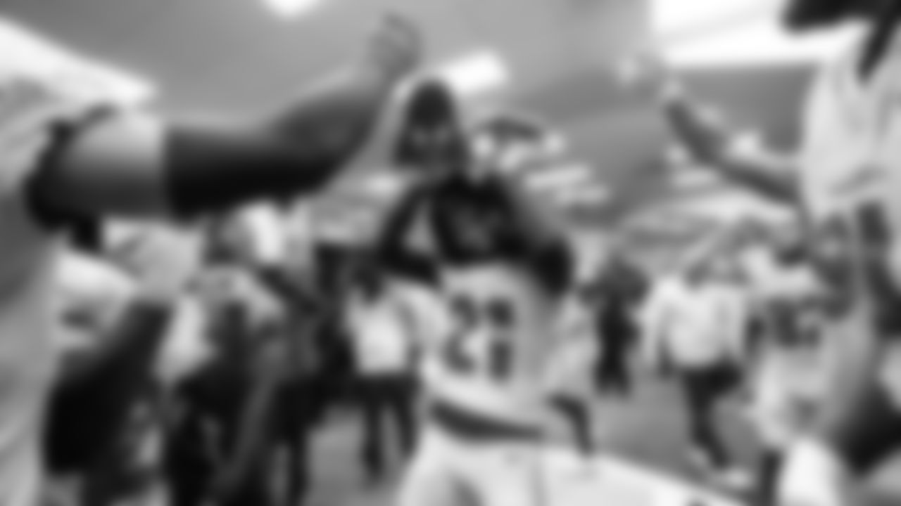 Seahawks cornerback Devon Witherspoon joins the celebration in the locker room after the come-from-behind win.