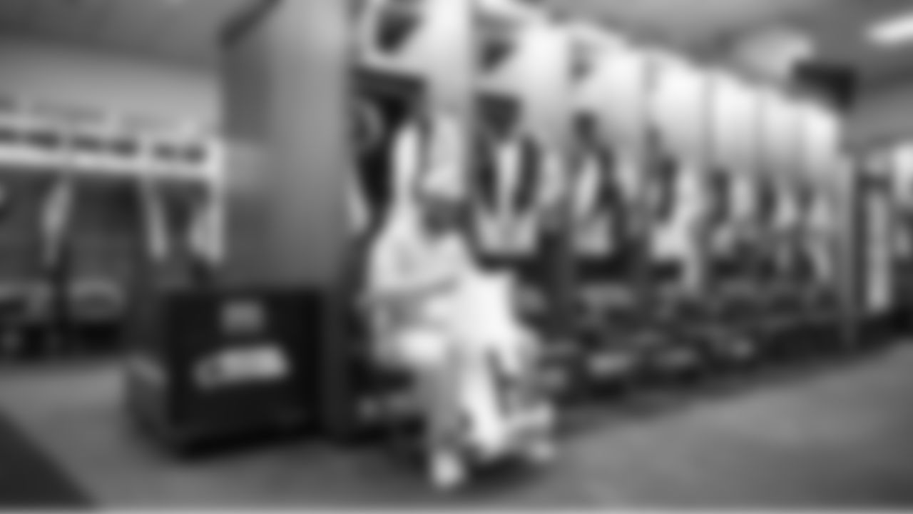 After the team landed, the Seahawks equipment staff heads straight to the stadium to prepare the locker room for the game. Assistant equipment manager Trevor Neal prepares Sam Darnold's uniform in the visitor's locker room at Nissan Stadium.