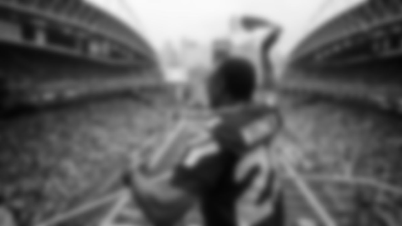 Seahawks Legend Curt Warner raises the 12 Flag before the 2nd preseason game against the Chiefs on August 15th.