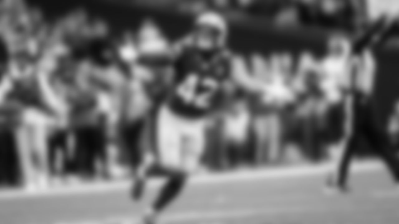 Seahawks linebacker Drake Thomas celebrates after making a quarterback sack.