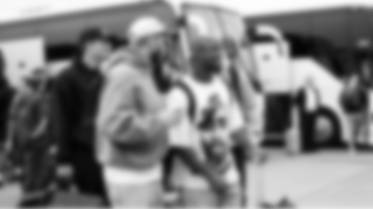 Seahawks receiver Cooper Kupp and running back Kenneth Walker III prepare to board the charter flight to Los Angeles.