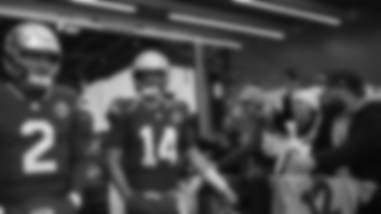 Seahawks quarterback Sam Darnold (14) walks through the Emerald Queen Casino tunnel club at Lumen Field for the Week 13 matchup vs. the Vikings.