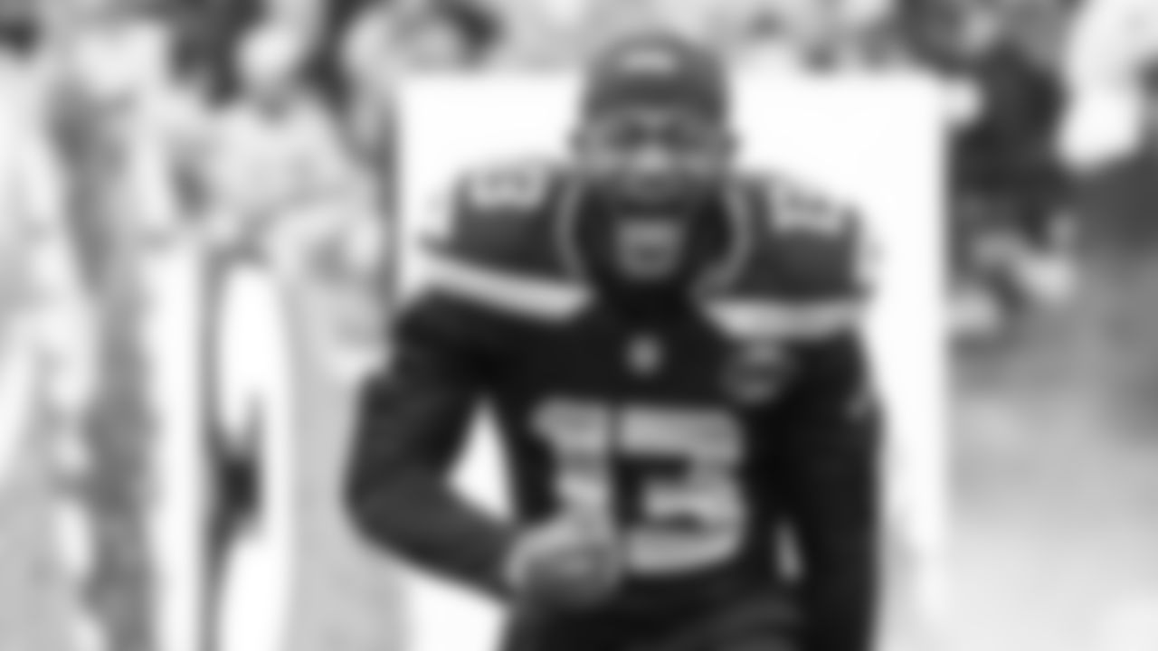 Linebacker Ernest Jones IV lets out a yell as he runs onto the field.