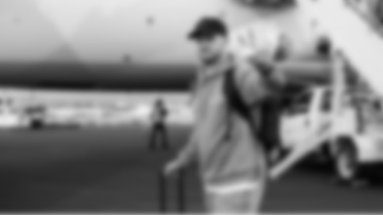 Seahawks quarterback Sam Darnold waves as he heads to the bus after the team landed in San Jose for Super Bowl LX.