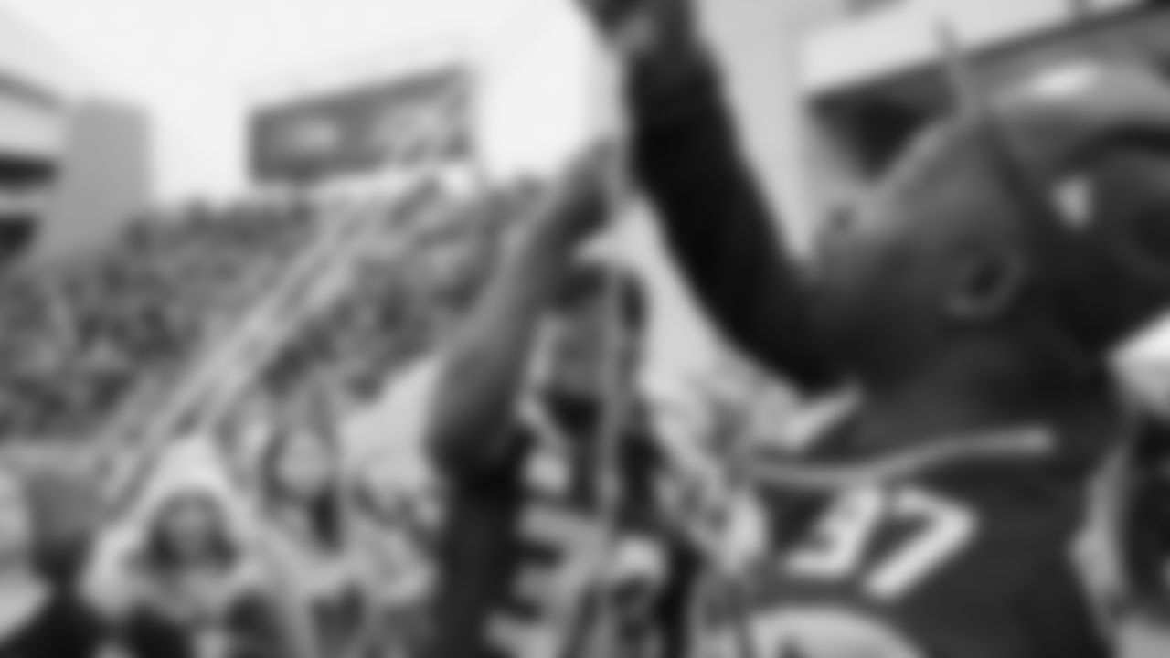 Seahawks Legends Rufus Porter and John L. Williams raise 12 flag in week 15 on December 14, 2025