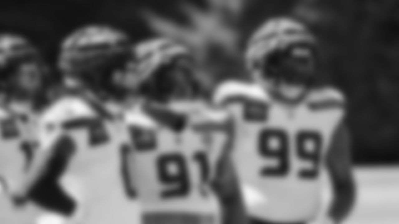 Seahawks defensive end DeMarcus Lawrence (0), defensive tackle Byron Murphy II (91) and defensive end Leonard Williams (99) practiced on August 12, 2025 at the Virginia Mason Athletic Center.