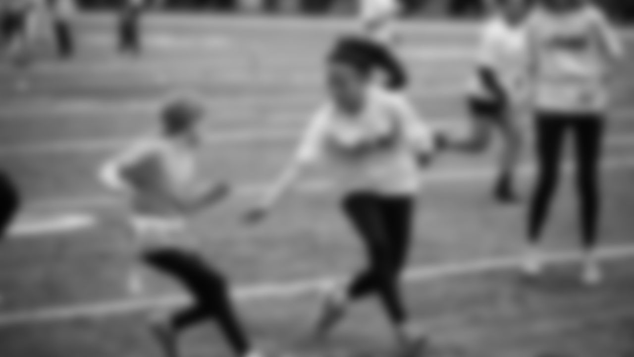 The Seahawks Women's Association packed girls flag kits and hosted a free girls flag football camp at the Seahawks training facility on Saturday, November 8, 2025.