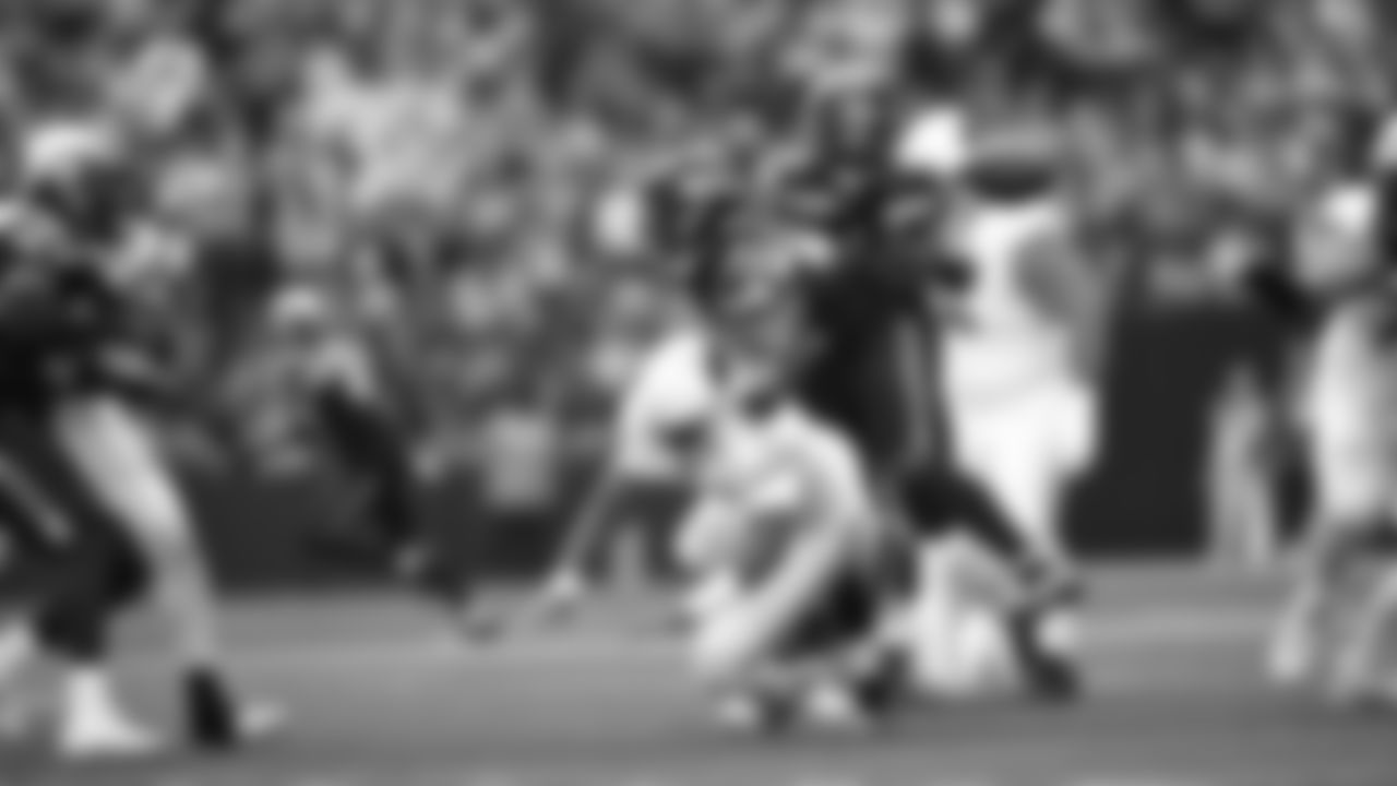 Seahawks linebacker Tyrice Knight (48) sacks Cardinals QB Jacoby Brissett and defensive end DeMarcus Lawrence (0) scoops the ball up and scores the touchdown.