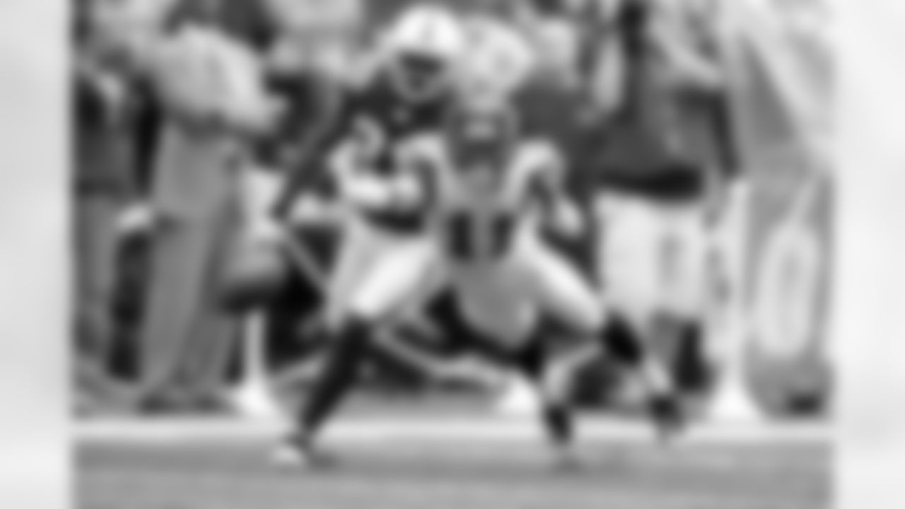 Seattle's Deon Butler dives but can't quite reach a long pass from Seneca Wallace.