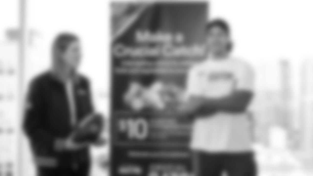 Seahawks wide receiver Jake Bobo presented the official game ball to Virginia Mason Franciscan Health on October 28, 2025.