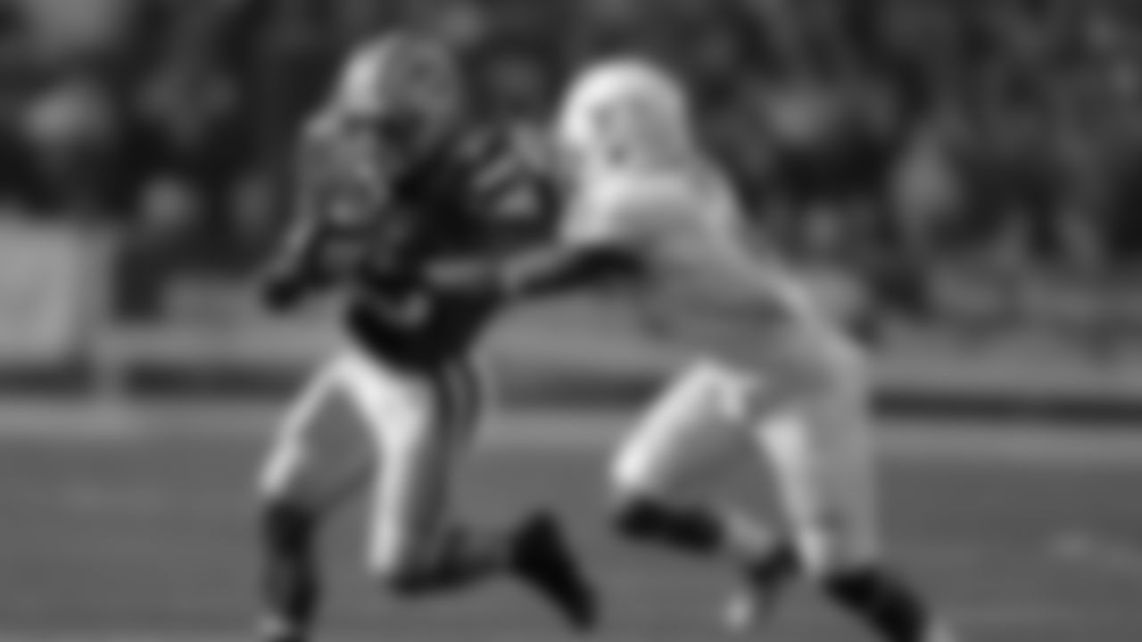 Kansas State running back John Hubert (33) tries to get away from Texas cornerback Quandre Diggs (6) during the second half of an NCAA college football game Saturday, Dec. 1, 2012, in Manhattan, Kan. Kansas State won the game 42-24. (AP Photo/Charlie Riedel)