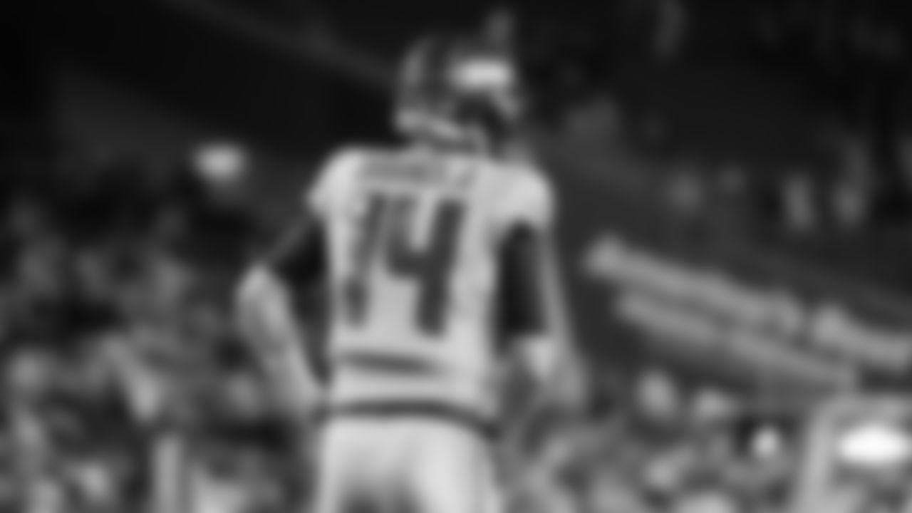 Seahawks quarterback Sam Darnold (14) warms up at Lumen Field for the Week 16 matchup vs. the L.A. Rams.