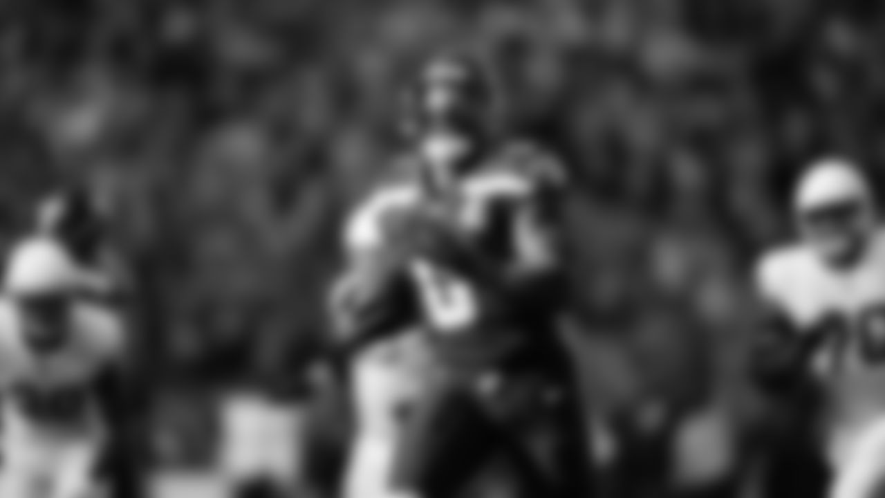 Seahawks linebacker Tyrice Knight (48) sacks Cardinals QB Jacoby Brissett and defensive end DeMarcus Lawrence (0) scoops the ball up and scores the touchdown.