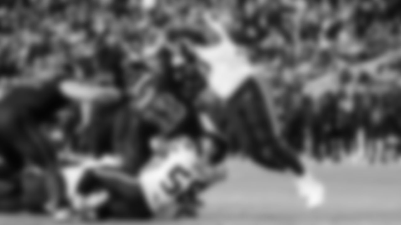 Seattle's Derick Hall and Leonard Williams put a punishing hit on 49ers quarterback Brock Purdy late in the game.