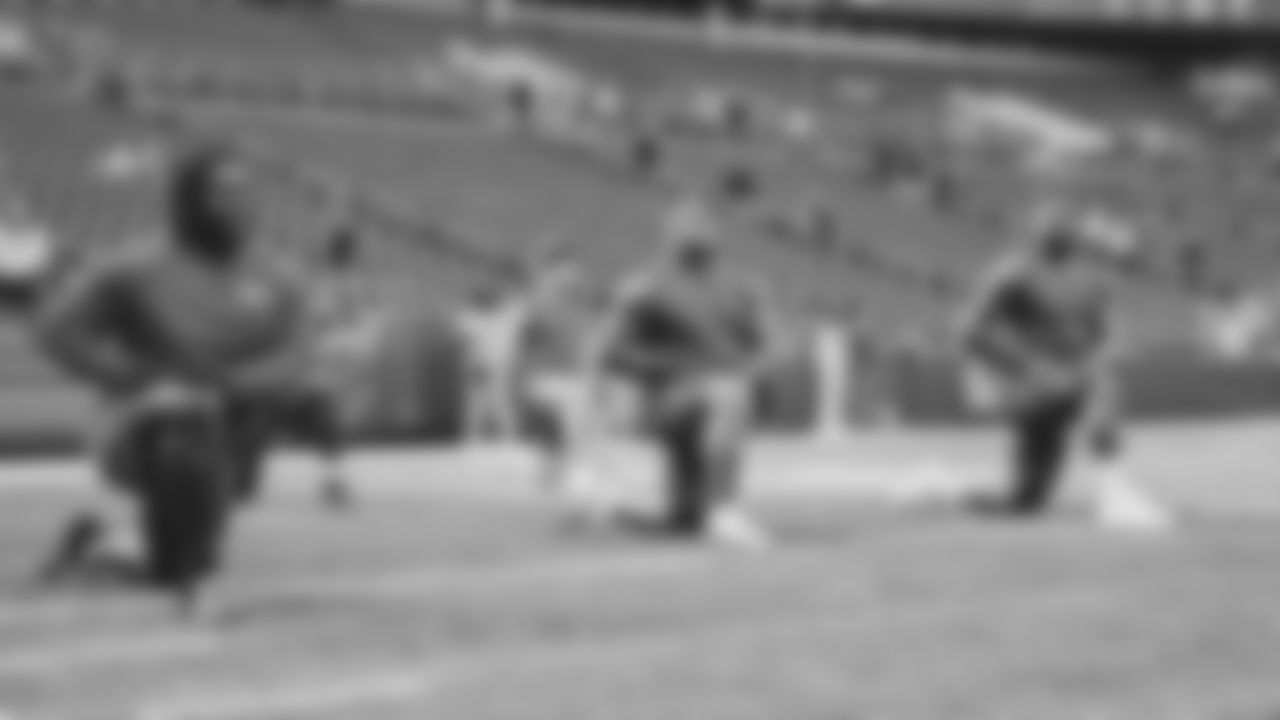 Seahawks defensive tackle Jarran Reed (90), defensive tackle Byron Murphy II (91) and defensive end Leonard Williams (99) warm up at Lumen Field for the Week 5 matchup vs. the Tampa Bay Buccaneers.