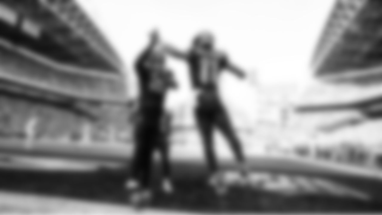 Seahawks receiver Jaxon Smith-Njigba celebrates with teammate Elijah Arroyo after Smith-Njigba scored the game's first touchdown.