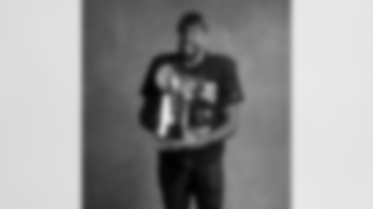 Seahawks defensive end Leonard Williams (99) with the Lombardi Trophy after winning Super Bowl LX.