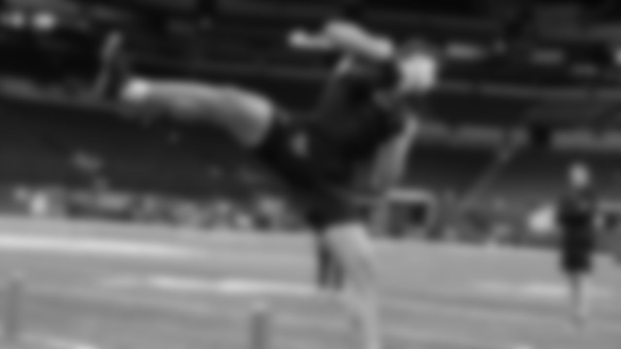 Michigan tight end AJ Barner runs a drill at the NFL football scouting combine, Friday, March 1, 2024, in Indianapolis. (AP Photo/Michael Conroy)