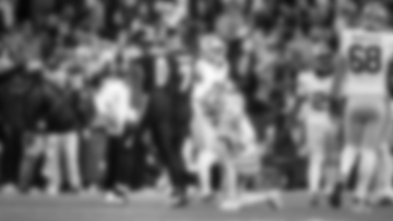 Seahawks DeMarcus Lawrence and Uchenna Nwosu walk off the field after causing a fumble by 49ers quarterback Brock Purdy.